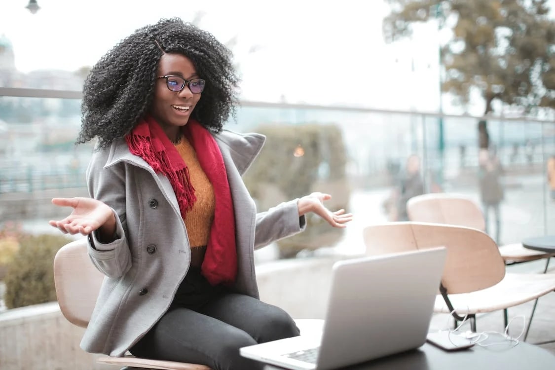 Woman impressed by her credit score on her laptop